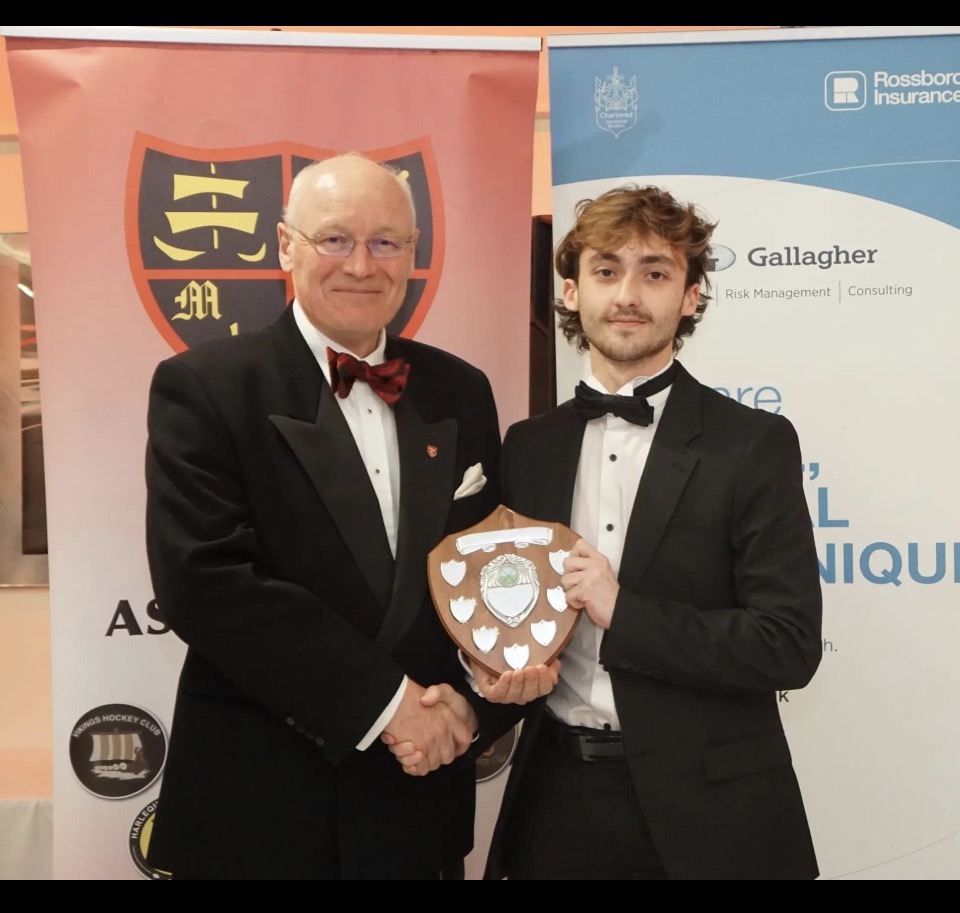 Dominic Hubble receiving an Isle of Man hockey Young Player of the Year award